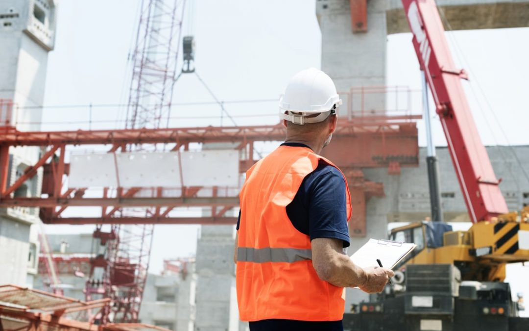 construction site with a man standing looking up